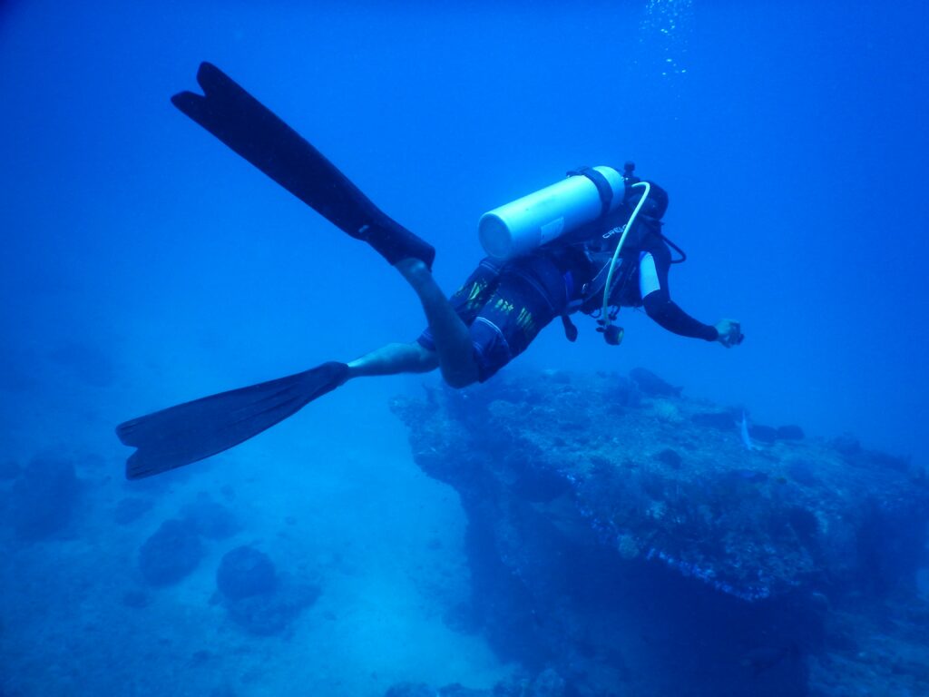 Scuba diver exploring underwater depths, capturing marine adventure vibes.